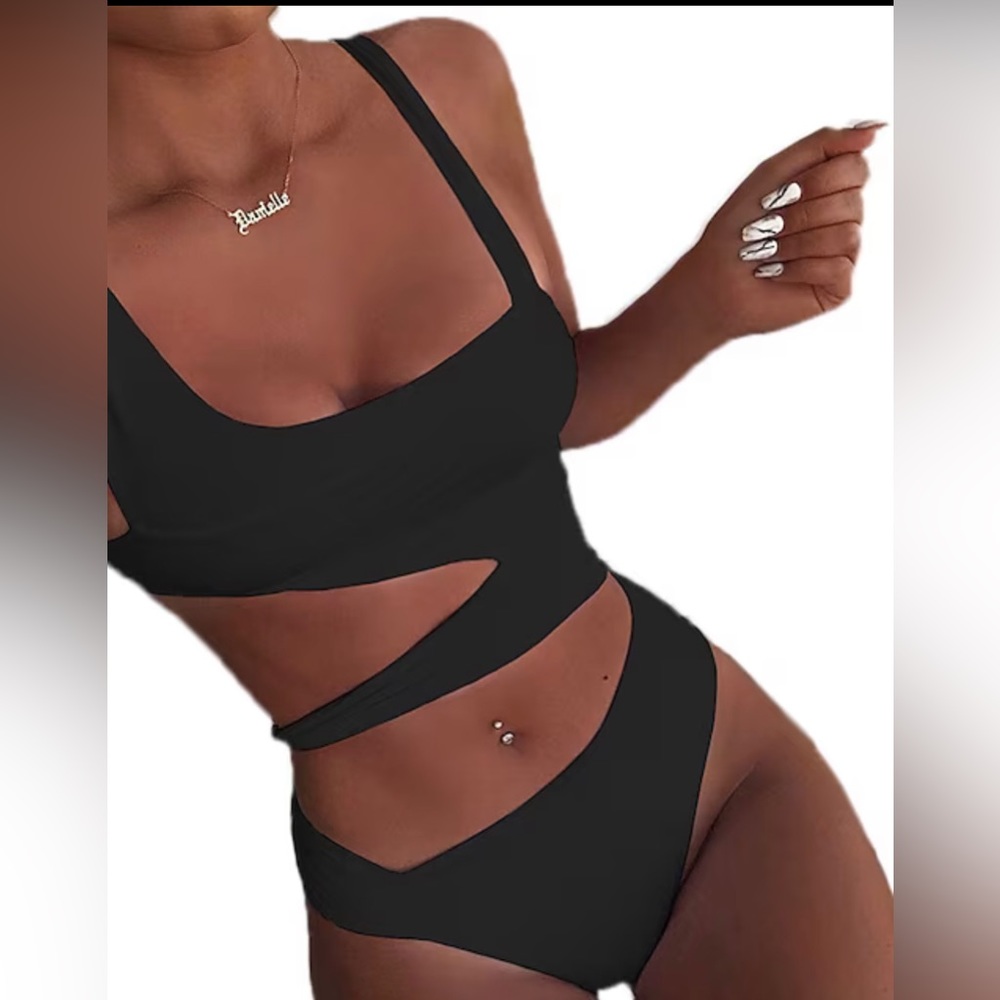One piece Monokini NEVER WORN . Splash with this flattering piece!l. S: Large